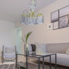 25"in POLISHED BRASS ACRYLIC/GLASS HARD-WIRED CHANDELIER - Image 2